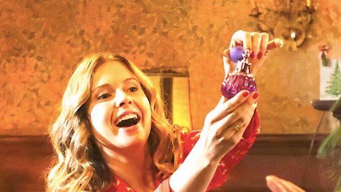 rose-mciver-s-sam-smiles-as-she-sprays-perfume-in-ghosts_11zon