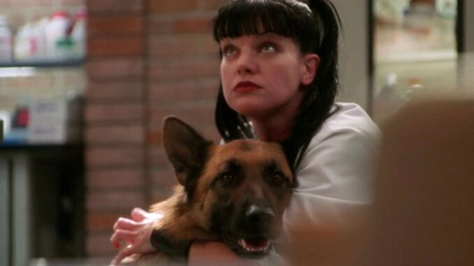 abby-with-her-arms-around-a-dog