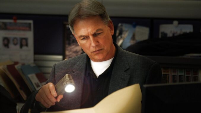 mark-harmon-examining-a-page-in