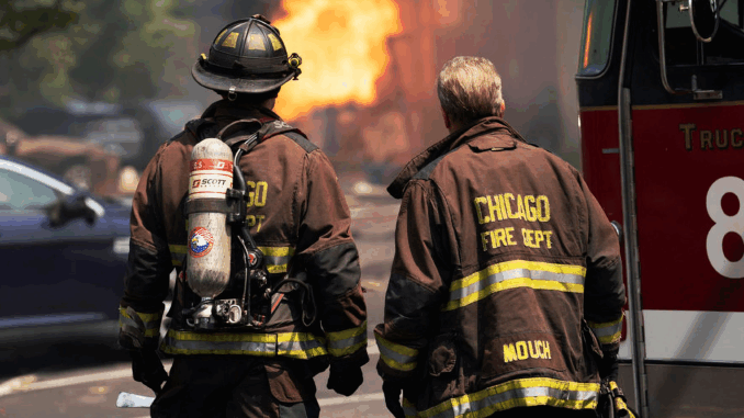 two-firefighters-looking-at-a-fi