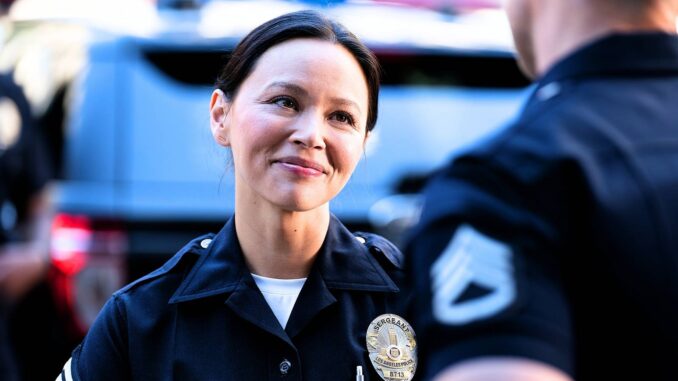 Lucy chen in uniform smiling out