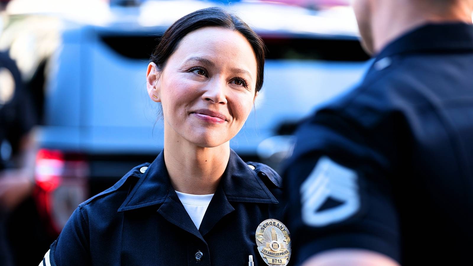 Lucy chen in uniform smiling out